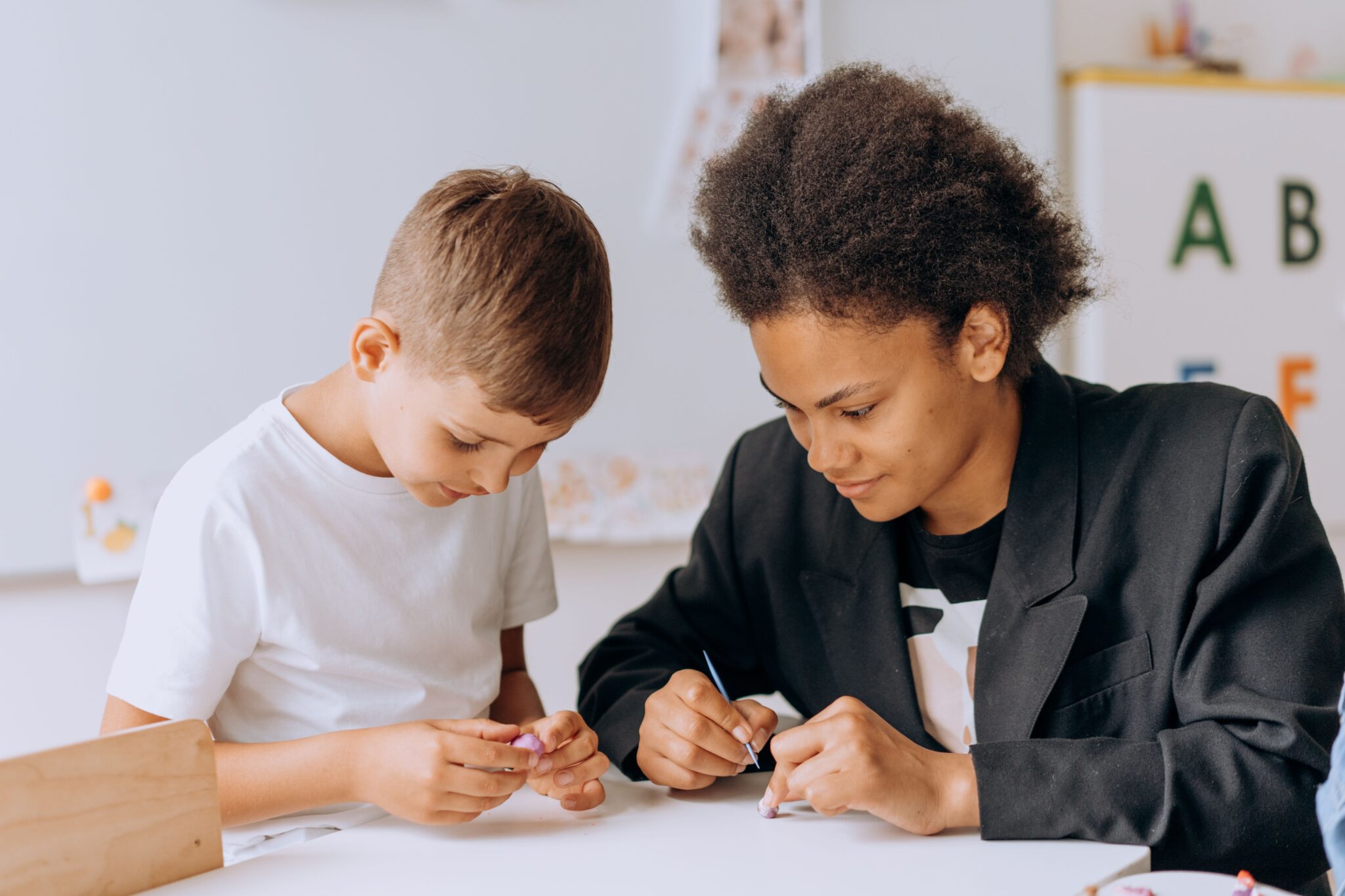 Teacher going over homework with a pupil